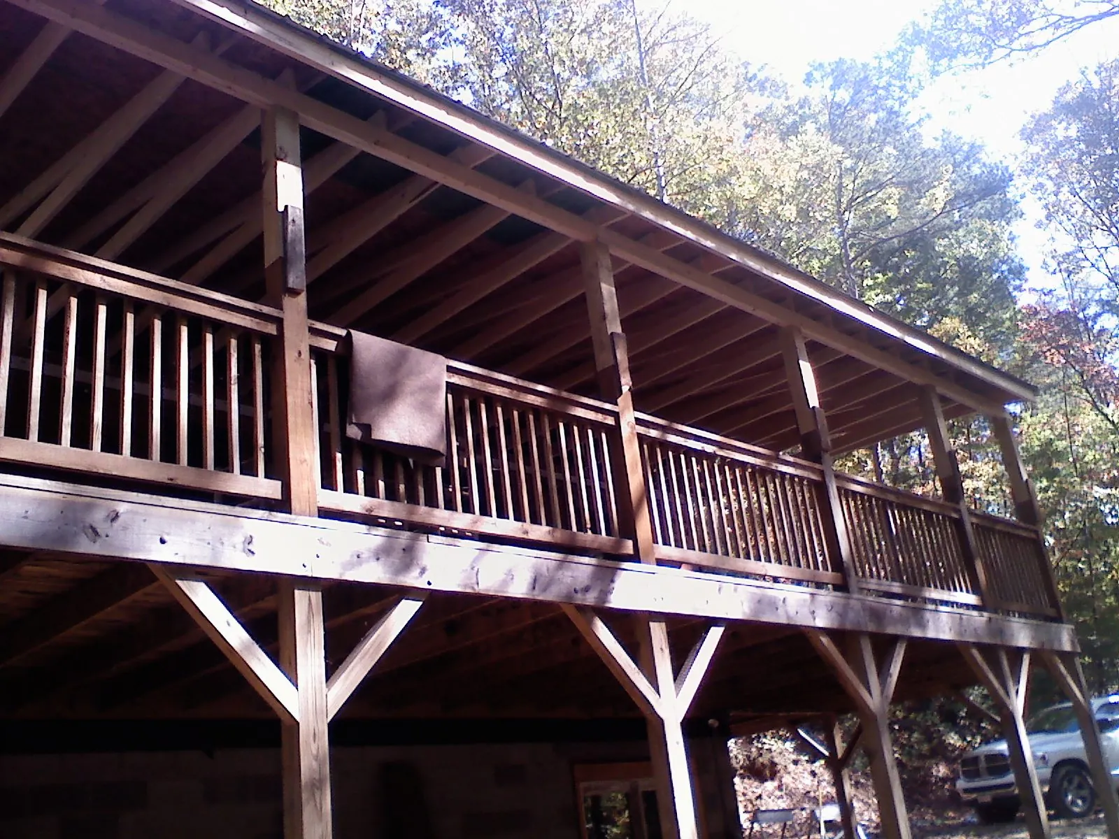 Timber framing under a new elevated porch and deck — Roof Leak Repair in Persia by Roofing Brothers